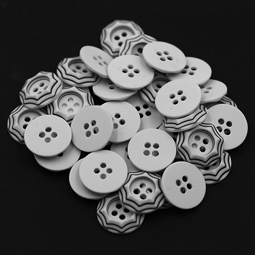 19260 Sullivans 18mm Round Plastic Button 4 Hole - White With Raised Black Borders - 70 In A Tube 