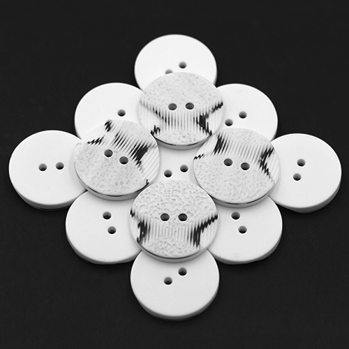 19306 Sullivans 30mm Round Plastic Button 2 Hole With 2 Textured Patterns - White With A Splash Of Black -