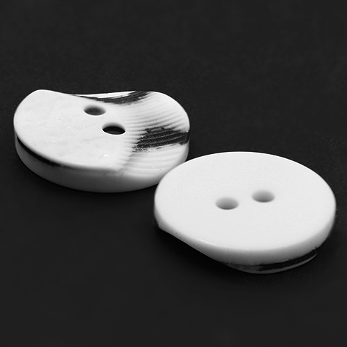 19304 Sullivans 15mm Round Plastic Button 2 Hole With 2 Textured Patterns - White With A Splash Of Black -