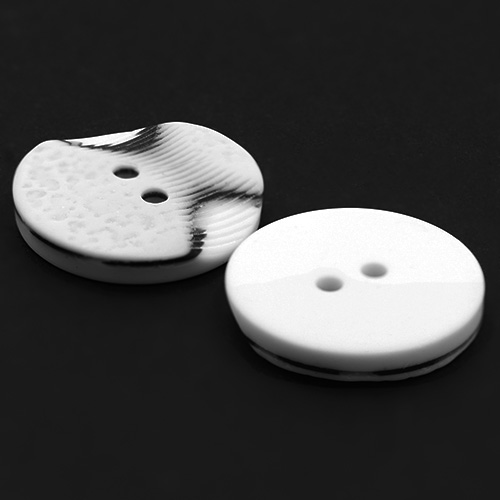 19305 Sullivans 21mm Round Plastic Button 2 Hole With 2 Textured Patterns - White With A Splash Of Black -