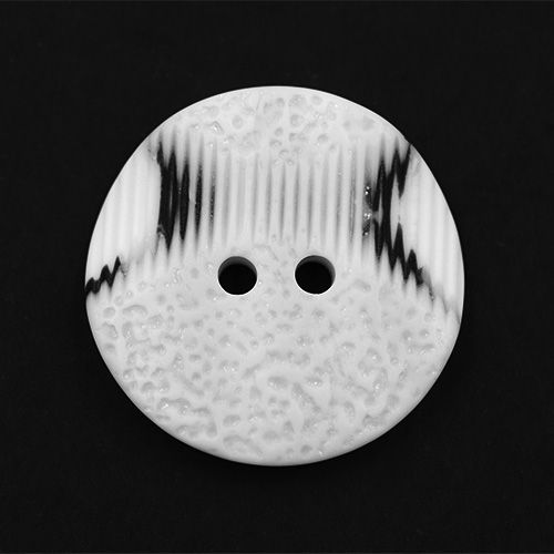 19306 Sullivans 30mm Round Plastic Button 2 Hole With 2 Textured Patterns - White With A Splash Of Black -
