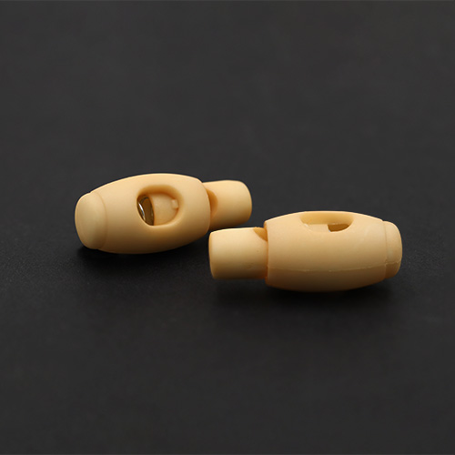 20931 Sullivans 32mm Plastic Cord Ends - Cream - 25 In A Tube