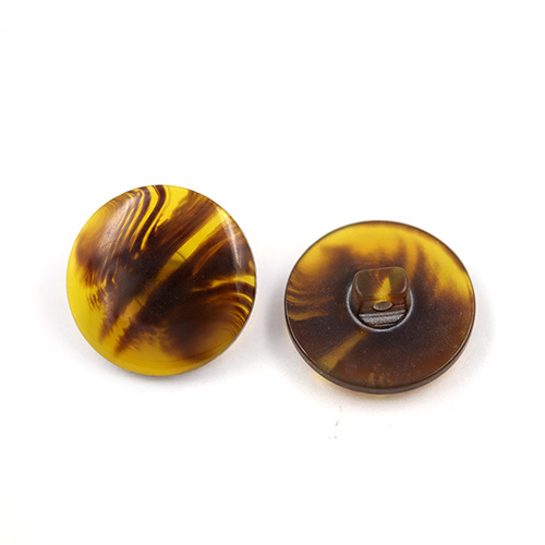21257 Sullivans 20mm Round Plastic Shank Button - Clear Amber Variegated Pattern - 19 In A Tube